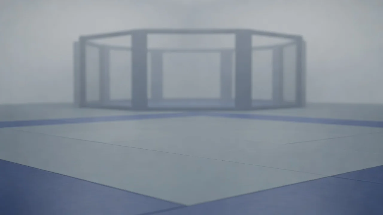 Clean grappling mats in an empty MMA gym with a cage in the background
